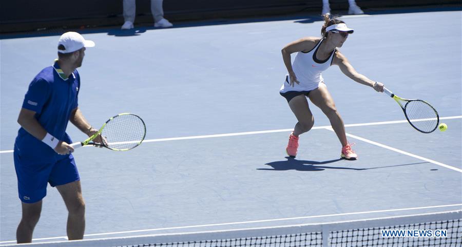 Xu Yifan (R) of China and Fabrice Martin of France compete during the mixed doubles first round match against Liezel Huber of the U.S. and Marcin Matkowski of Poland at the Australian Open Tennis Championships in Melbourne, Australia, Jan. 22, 2017. Xu Yifan and Fabrice Martin won 2-0. (Xinhua/Lui Siu Wai)