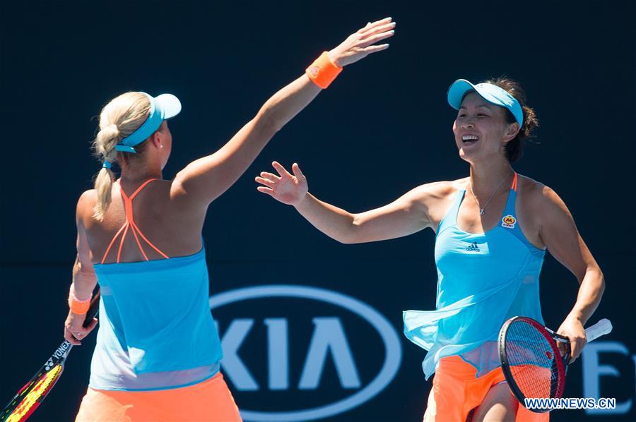 Peng Shuai (R) of China and Andrea Hlavackova of the Czech Republic celebrate after winning the women's doubles third round match against Andreja Klepac of Slovenia and Maria Jose Martinez Sanchez of Spain at the Australian Open Tennis Championships in Melbourne, Australia, Jan. 22, 2017. Peng Shuai and Andrea Hlavackova won 2-0. (Xinhua/Bai Xue) 