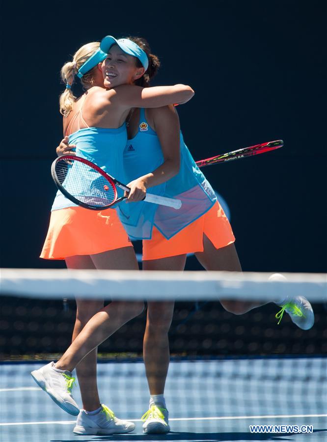 Peng Shuai (R) of China and Andrea Hlavackova of the Czech Republic celebrate after winning the women's doubles third round match against Andreja Klepac of Slovenia and Maria Jose Martinez Sanchez of Spain at the Australian Open Tennis Championships in Melbourne, Australia, Jan. 22, 2017. Peng Shuai and Andrea Hlavackova won 2-0.(Xinhua/Bai Xue) 