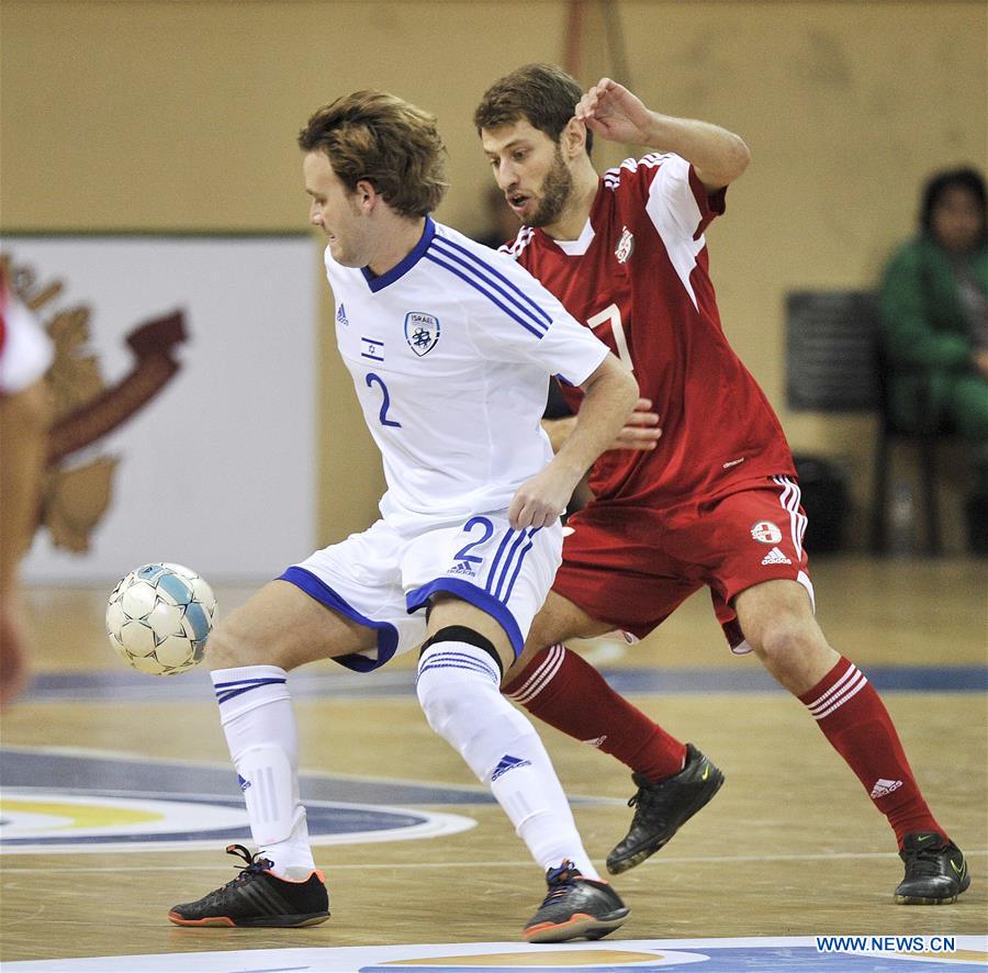 Georgia's Shota Topuria (R) vies with Israel's Yotam Bliech during the preliminary round of the European Futsal Championship 2018 between Georgia and Israel in Tbilisi, Georgia, Jan. 24, 2017. (Xinhua/Kulumbegashvili Tamuna) 