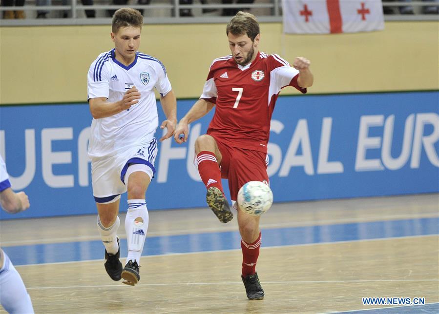 Georgia's Shota Topuria (R) competes during the preliminary round of the European Futsal Championship 2018 between Georgia and Israel in Tbilisi, Georgia, Jan. 24, 2017. (Xinhua/Kulumbegashvili Tamuna) 