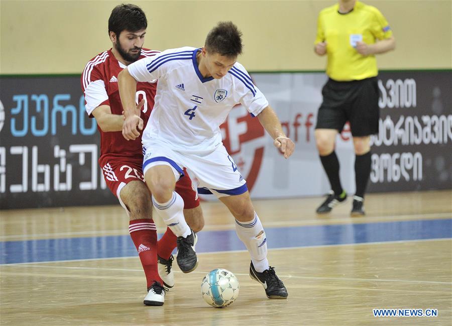 Georgia's Giorgi Tikurishvili (L) vies with Israel's Ivan Diedunov during the preliminary round of the European Futsal Championship 2018 between Georgia and Israel in Tbilisi, Georgia, Jan. 24, 2017. (Xinhua/Kulumbegashvili Tamuna) 