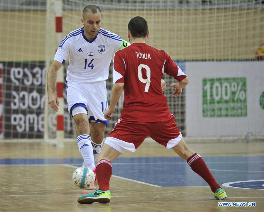 Georgia's Irakli Todua (R) vies with Israel's Adam Cohen during the preliminary round of the European Futsal Championship 2018 between Georgia and Israel in Tbilisi, Georgia, Jan. 24, 2017. (Xinhua/Kulumbegashvili Tamuna) 