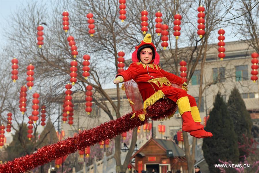 A child performs at a temple fair in Taiyuan, capital of north China's Shanxi Province, Feb. 3, 2017, the 7th day of the Chinese Lunar New Year.