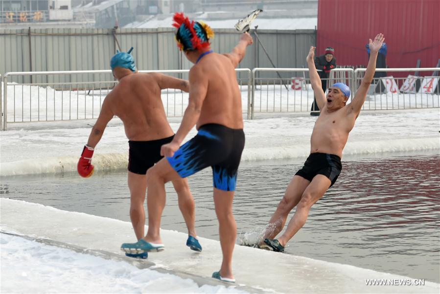 Winter swimmers perform on-ice boxing in Harbin, capital of northeast China's Heilongjiang Province, Feb. 4, 2017