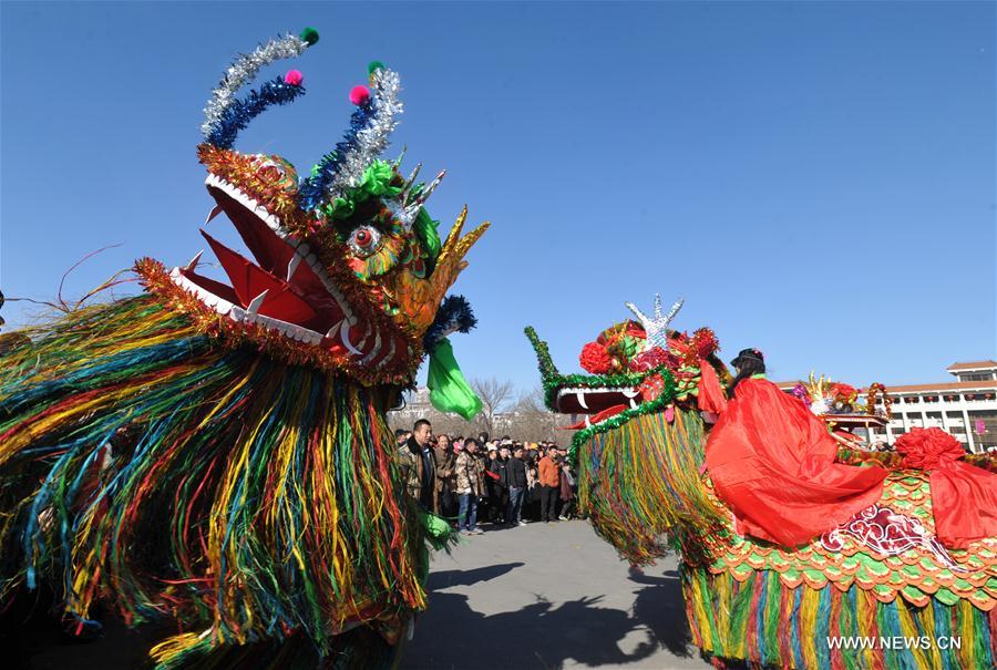 Folk artists perform kylin (a mythical creature in Chinese legend) dance to greet the upcoming Lantern Festival in Huanghua, north China's Hebei Province, Feb. 9, 2017. 