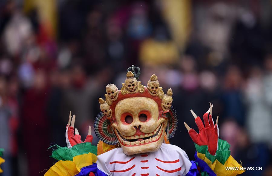 A monk performs 'Tiaoqian', a masked religious dance with a history of nearly 300 years, at the Kumbum Monastery in Huangzhong County, northwest China's Qinghai Province, Feb. 10, 2017. A monk performs 'Tiaoqian', a masked religious dance with a history of nearly 300 years, at the Kumbum Monastery in Huangzhong County, northwest China's Qinghai Province, Feb. 10, 2017.