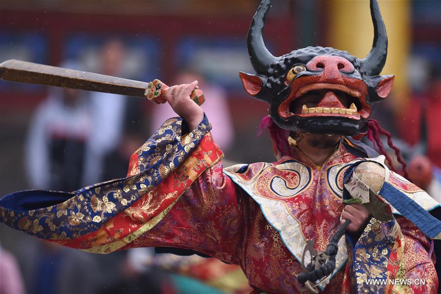A monk performs 'Tiaoqian', a masked religious dance with a history of nearly 300 years, at the Kumbum Monastery in Huangzhong County, northwest China's Qinghai Province, Feb. 10, 2017. A monk performs 'Tiaoqian', a masked religious dance with a history of nearly 300 years, at the Kumbum Monastery in Huangzhong County, northwest China's Qinghai Province, Feb. 10, 2017.