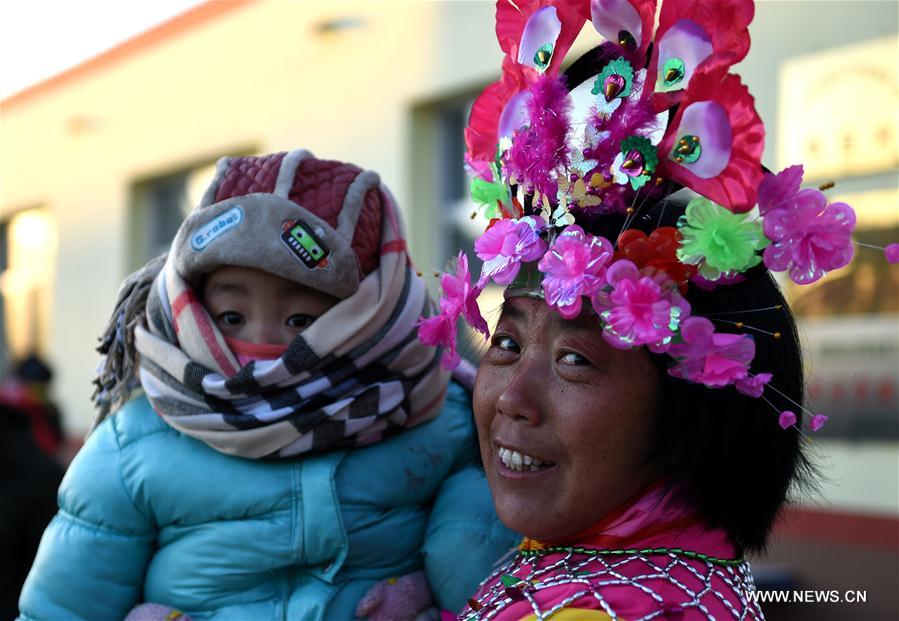 People perform Yangge dance during a festive ritual to pray for a good year at Guanyingzi Village of Mongolian Autonomous County of Fuxin, northeast China's Liaoning Province, Feb. 11, 2017.