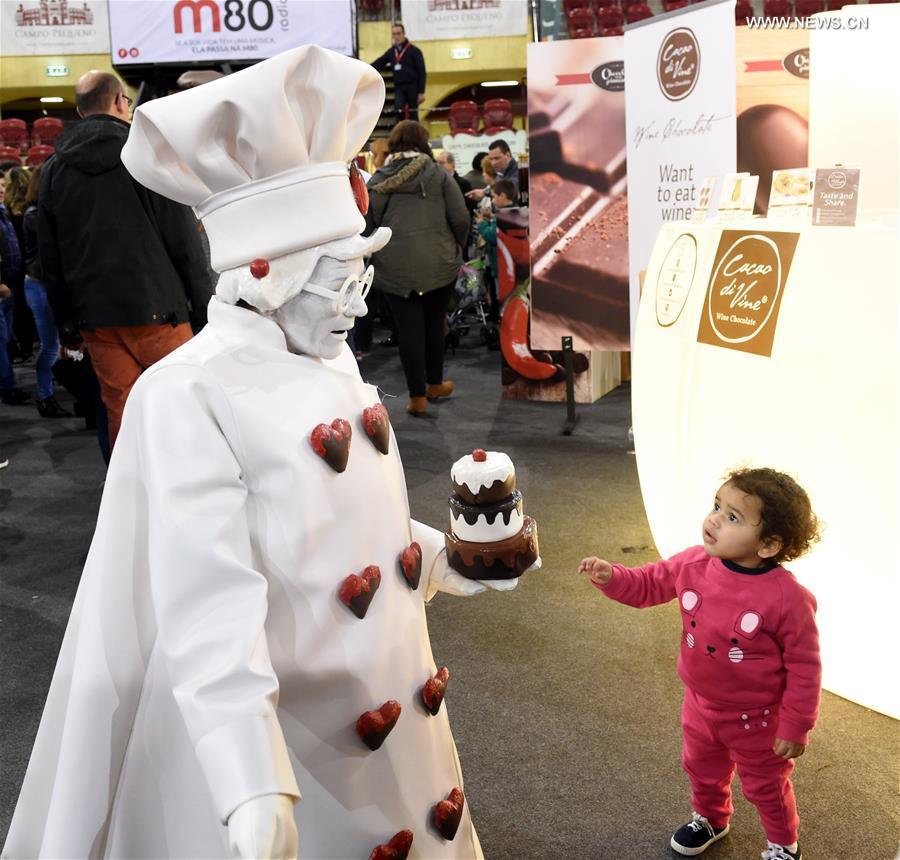 A little girl visits the chocolate fair at Campo Pequeno Square in Lisbon, capital of Portugal, Feb. 12, 2017.