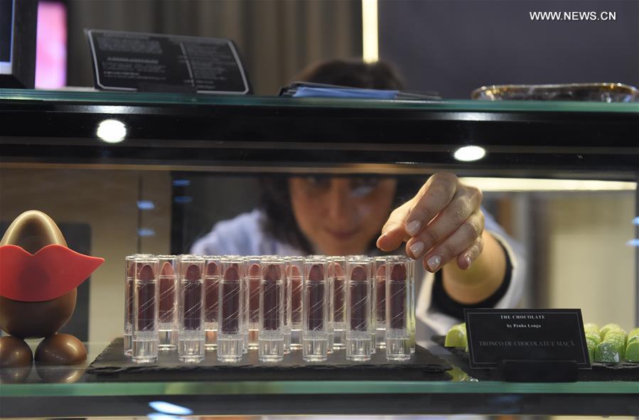 A woman displays lipsticks made of chocolate during a chocolate fair at Campo Pequeno Square in Lisbon, capital of Portugal, Feb. 12, 2017. A woman displays lipsticks made of chocolate during a chocolate fair at Campo Pequeno Square in Lisbon, capital of Portugal, Feb. 12, 2017.