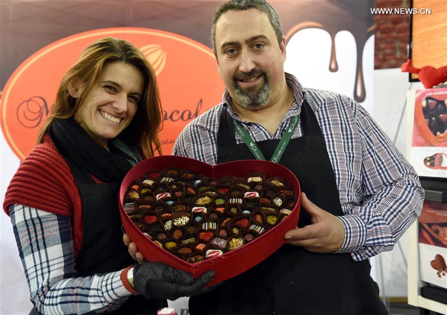People display chocolates during a chocolate fair at Campo Pequeno Square in Lisbon, capital of Portugal, Feb. 12, 2017. People display chocolates during a chocolate fair at Campo Pequeno Square in Lisbon, capital of Portugal, Feb. 12, 2017.