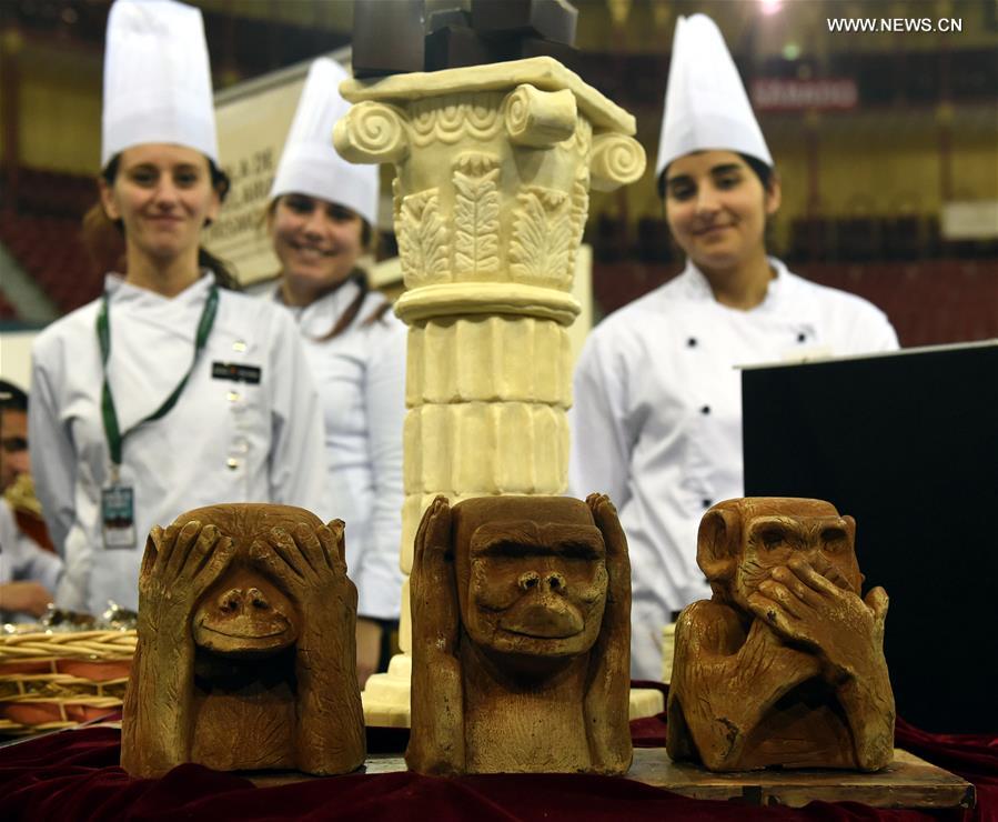 Three monkey sculptures made of chocolate are displayed during a chocolate fair at Campo Pequeno Square in Lisbon, capital of Portugal, Feb. 12, 2017. 