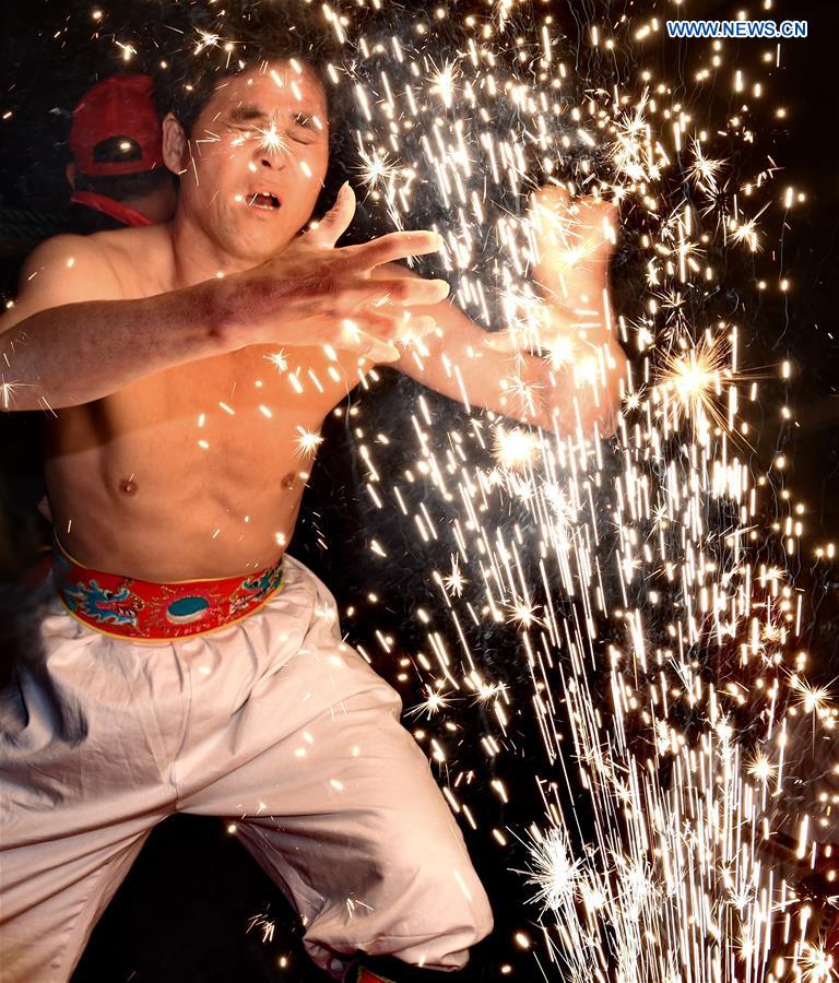 A villager performs 'firework eating' in Huadong Village, Putian City of southeast China's Fujian Province, Feb. 12, 2017. A villager performs 'firework eating' in Huadong Village, Putian City of southeast China's Fujian Province, Feb. 12, 2017.
