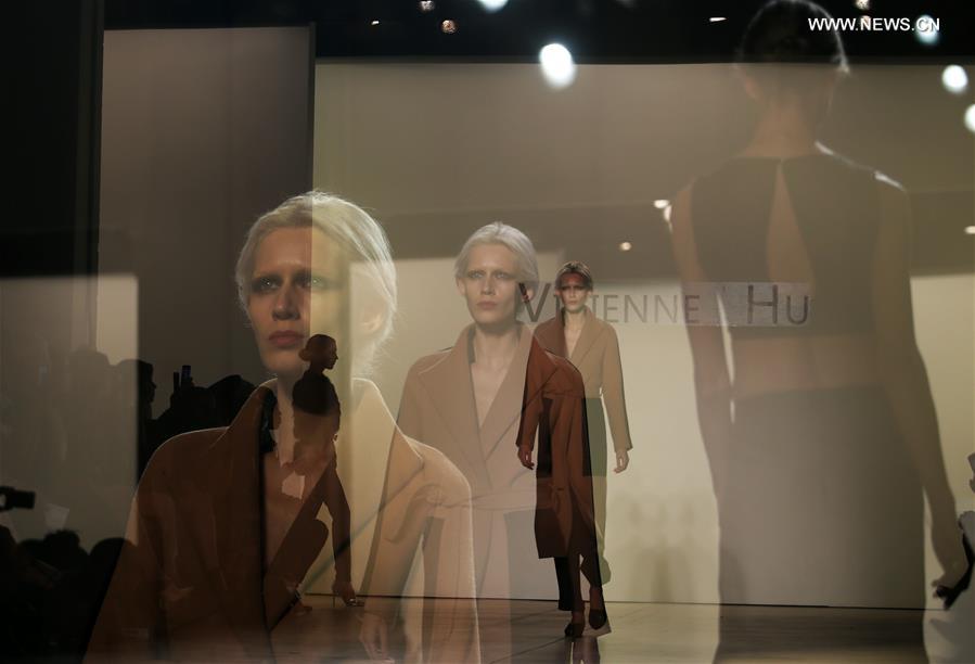 The multiple exposure photo taken on Feb. 12, 2017 shows models presenting creations of Vivienne Hu during the 2017 New York Fashion Week in New York City, the United States.