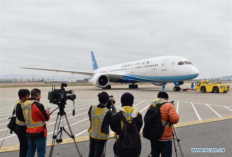 Cameramen record the take-off of flight MF849 at the Fuzhou International Airport in Fuzhou, capital of southeast China's Fujian Province, Feb. 15, 2017. MF849, the first direct flight of Xiamen Airlines from Fuzhou to New York, took off here on Wednesday.