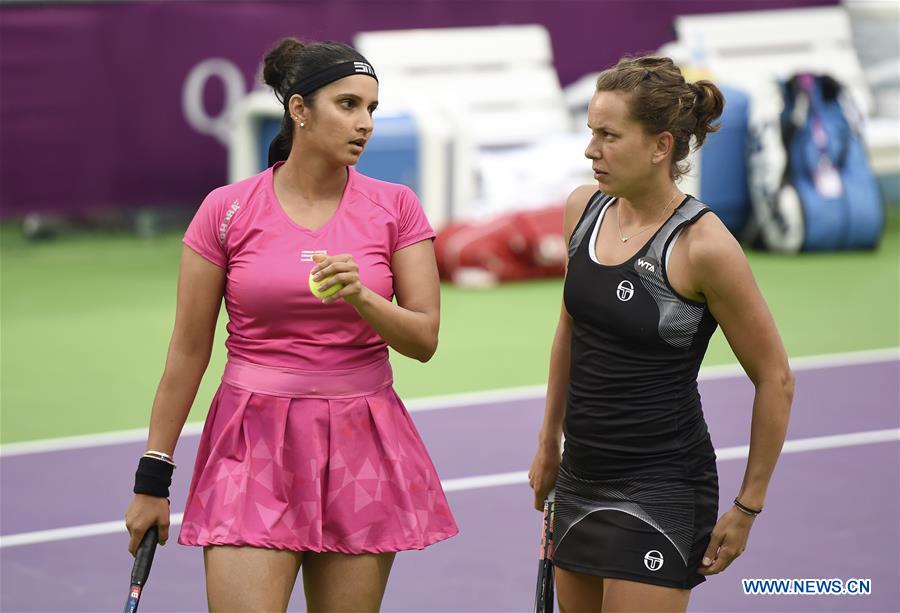 Sania Mirza (L) of India and Barbora Strycova of Czech Republic communicate during the women's doubles 1st round match against Xu Yifan of China and Raquel Atawo of the United States at WTA Qatar Open 2017 at the International Khalifa Tennis Complex of Doha, Qatar, Feb. 16, 2017. Mirza and Strycova won 2-0. (Xinhua/Nikku) 
