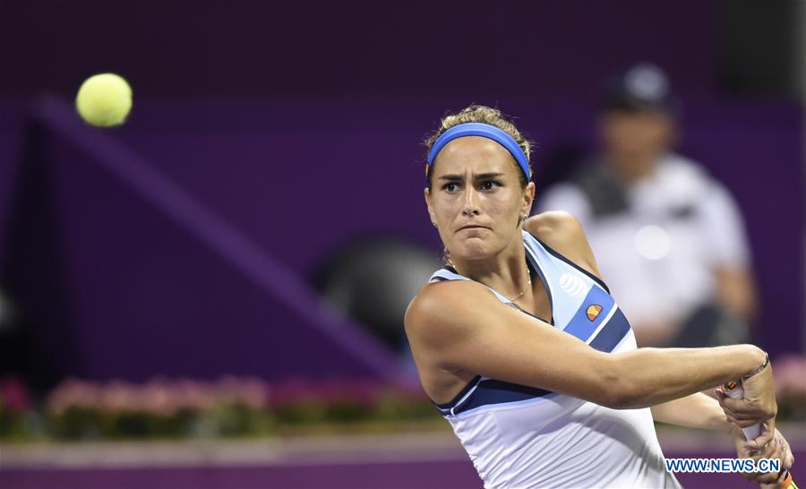 Monica Puig of Puerto Rico returns the ball during the women's singles quarterfinal against Daria Kasatkina of Russia at WTA Qatar Open 2017 at the International Khalifa Tennis Complex of Doha, Qatar, Feb. 16, 2017. The match was suspended due to the rain. (Xinhua/Nikku) 