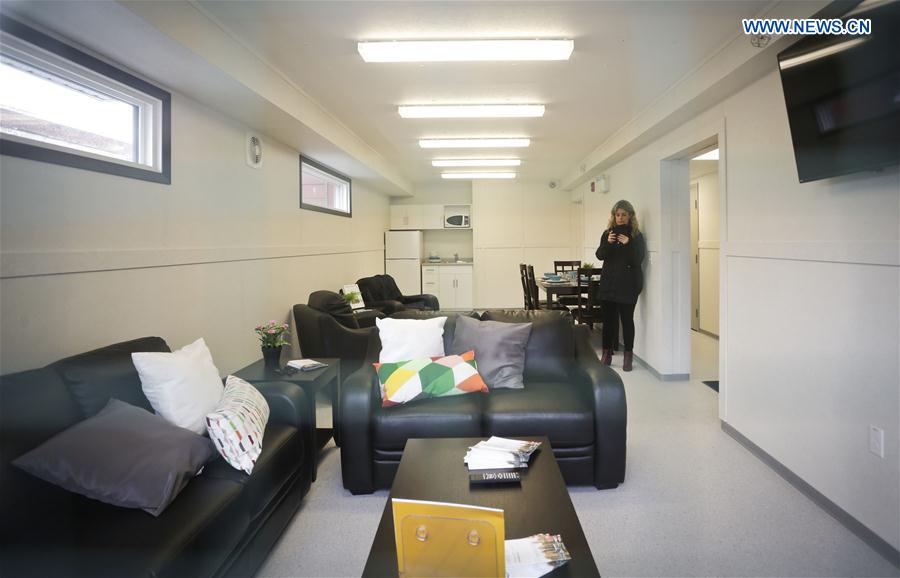 A woman visits the interior of a temporary modular house unit in Vancouver, Canada, Feb. 16, 2017.
