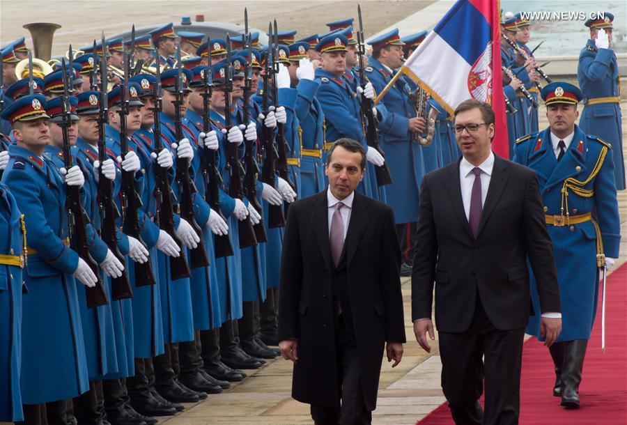 Austrian Chancellor Christian Kern (1st L) reviews the guard of honor, accompanied by Serbian Prime Minister Aleksandar Vucic, at the Palace of Serbia in Belgrade, Serbia, on Feb. 17, 2017.