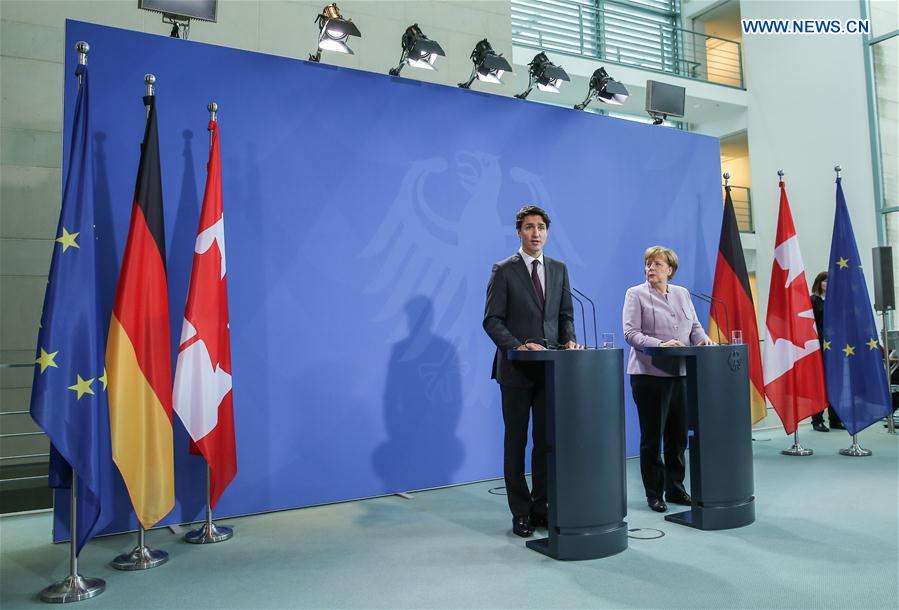 German Chancellor Angela Merkel (R) and visiting Canadian Prime Minister Justin Trudeau attend a joint press conference in Berlin, capital of Germany, on Feb. 17, 2017. 