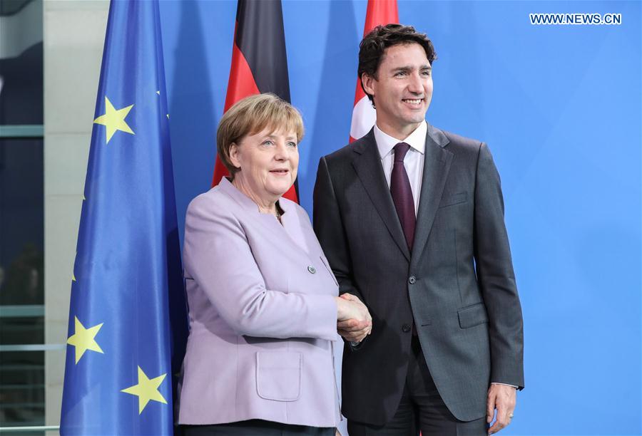 German Chancellor Angela Merkel (L) shakes hands with visiting Canadian Prime Minister Justin Trudeau after a joint press conference in Berlin, capital of Germany, on Feb. 17, 2017. 