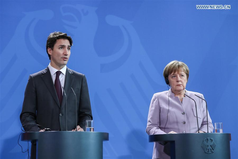 German Chancellor Angela Merkel (R) and visiting Canadian Prime Minister Justin Trudeau attend a joint press conference in Berlin, capital of Germany, on Feb. 17, 2017. 