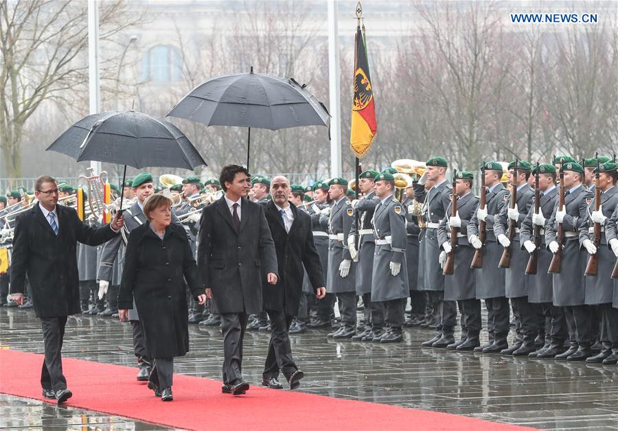 German Chancellor Angela Merkel (2nd L Front) and visiting Canadian Prime Minister Justin Trudeau inspect the honor guard during the welcome ceremony in Berlin, capital of Germany, on Feb. 17, 2017. German Chancellor Angela Merkel (2nd L Front) and visiting Canadian Prime Minister Justin Trudeau inspect the honor guard during the welcome ceremony in Berlin, capital of Germany, on Feb. 17, 2017.