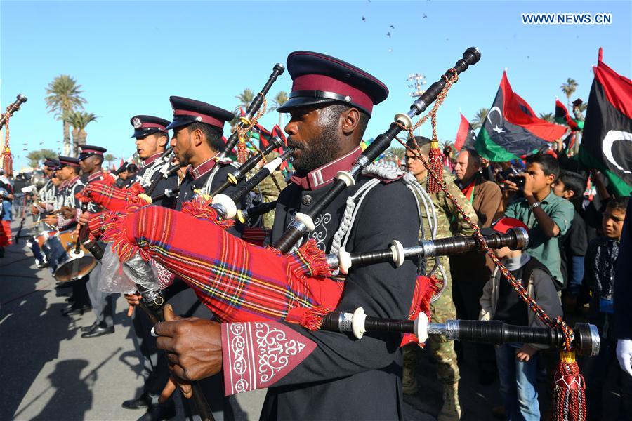 Libyan scouts march marking the sixth anniversary of the Libyan revolution in Tripoli, capital of Libya, on Feb. 17, 2017.