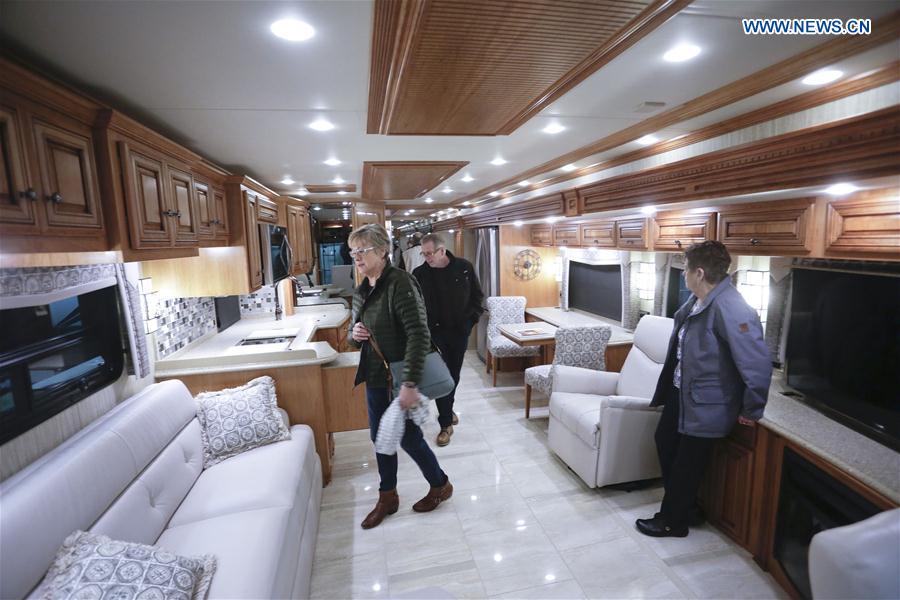 People visit a recreation vehicle during the Earlybird RV Show in Vancouver, Canada, Feb. 17, 2017.