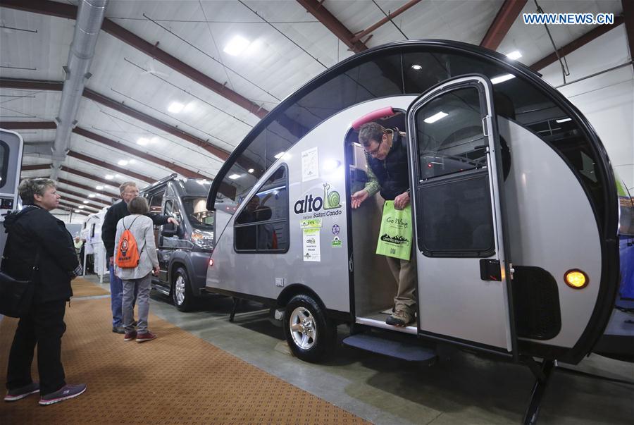 People visit a recreation vehicle during the Earlybird RV Show in Vancouver, Canada, Feb. 17, 2017.
