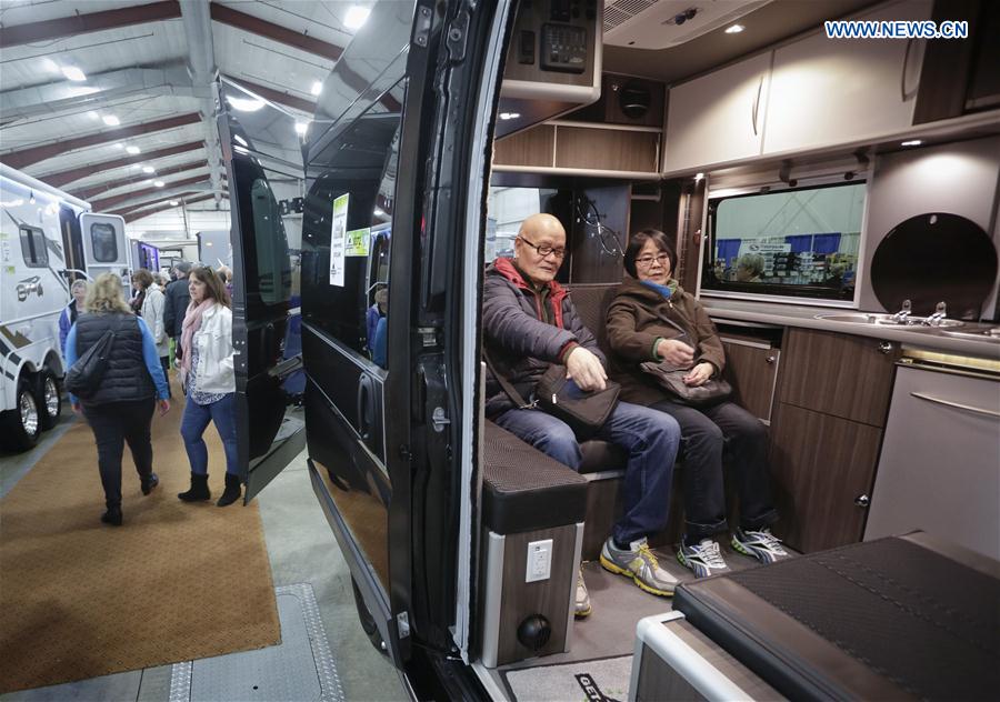 People visit a recreation vehicle during the Earlybird RV Show in Vancouver, Canada, Feb. 17, 2017.