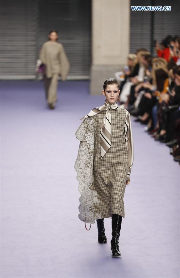 A model showcases a design at the Mulberry show during the London Fashion Week February 2017 collections in London, Britain, on Feb. 19, 2017. 