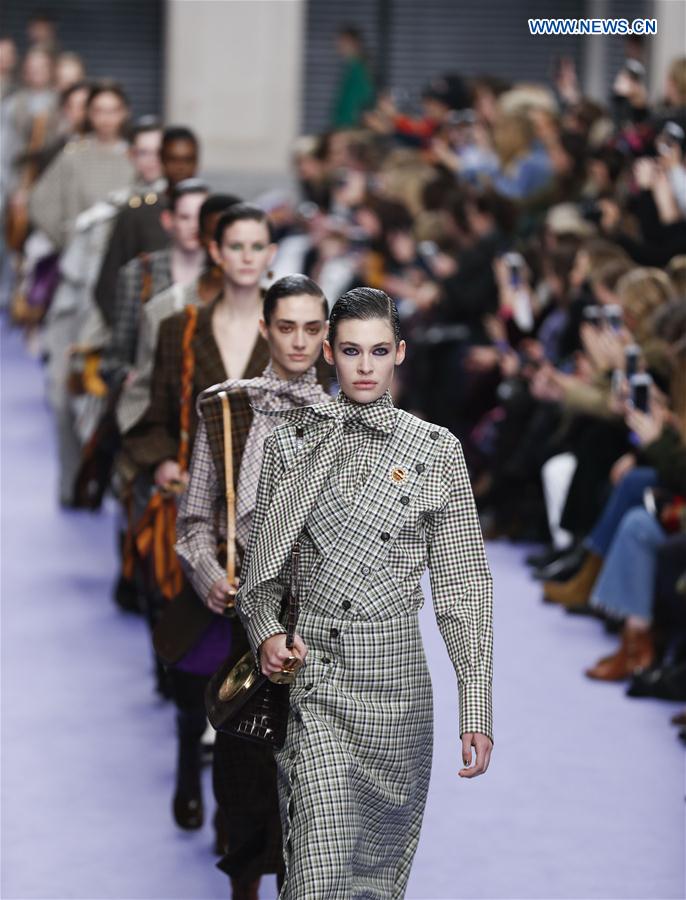 Models showcase designs at the Mulberry show during the London Fashion Week February 2017 collections in London, Britain, on Feb. 19, 2017.