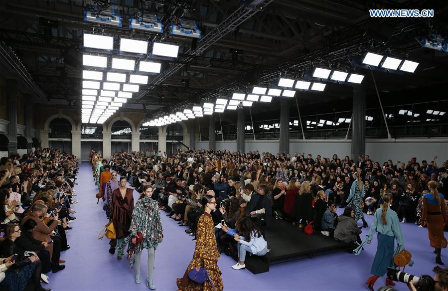 Models showcase designs at the Mulberry show during the London Fashion Week February 2017 collections in London, Britain, on Feb. 19, 2017. 