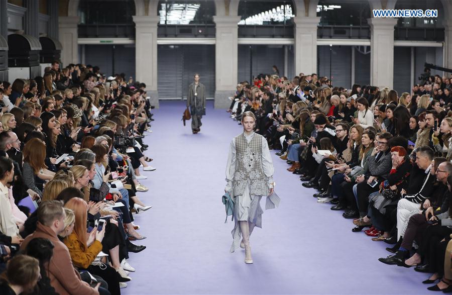 A model showcases a design at the Mulberry show during the London Fashion Week February 2017 collections in London, Britain, on Feb. 19, 2017.