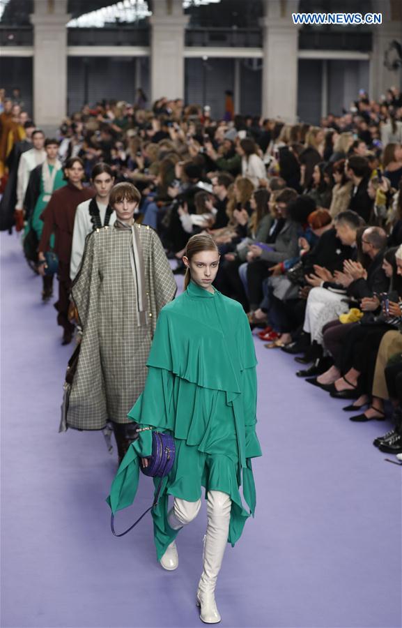 Models showcase designs at the Mulberry show during the London Fashion Week February 2017 collections in London, Britain, on Feb. 19, 2017. 
