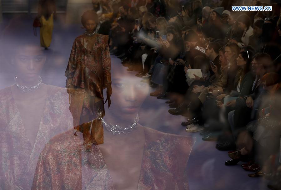 A model showcases a design at the Mulberry show during the London Fashion Week February 2017 collections in London, Britain, on Feb. 19, 2017. 