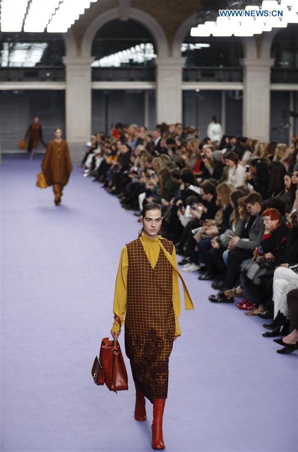 A model showcases a design at the Mulberry show during the London Fashion Week February 2017 collections in London, Britain, on Feb. 19, 2017. 