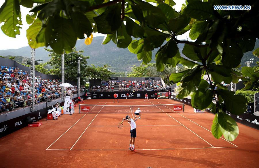 Juan Sebastian Cabal and Robert Farah (front) of Colombia serve during their 1st round doubles match against Thomaz Bellucci and Thiago Monteiro of Brazil at the 2017 ATP Rio Open tennis tournament held at the Brazilian Jockey Club in Rio de Janeiro, Brazil, on Feb. 22, 2017. 