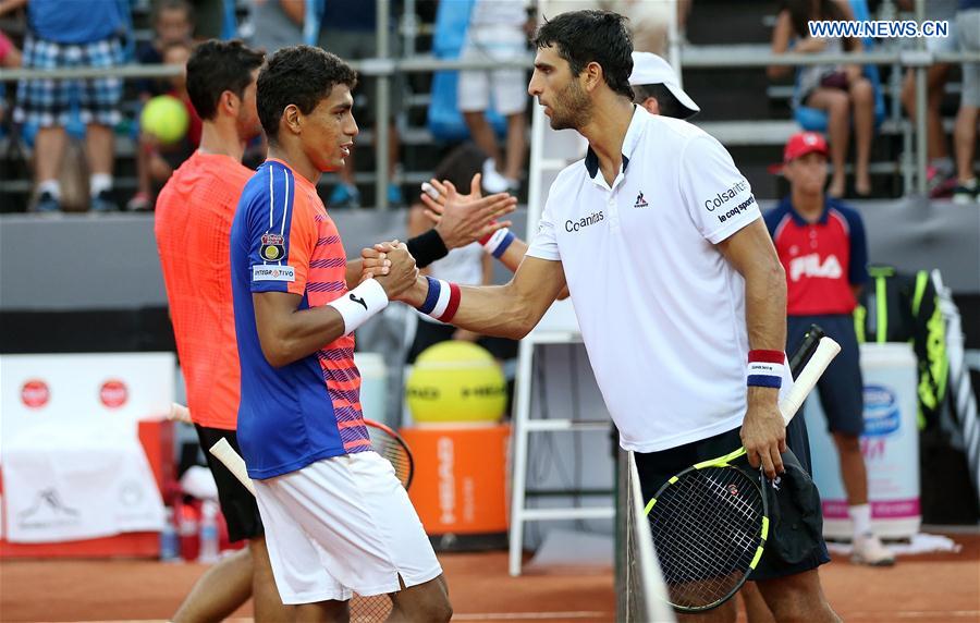 Juan Sebastian Cabal and Robert Farah (front R) of Colombia greet Thomaz Bellucci and Thiago Monteiro (front L) of Brazil after their 1st round doubles match at the 2017 ATP Rio Open tennis tournament held at the Brazilian Jockey Club in Rio de Janeiro, Brazil, on Feb. 22, 2017.