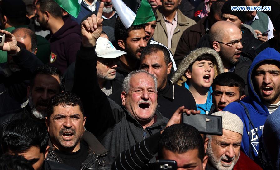 Hundreds of Jordanians protest the increase of prices and taxes by the government in Amman, Jordan, on Feb. 24.