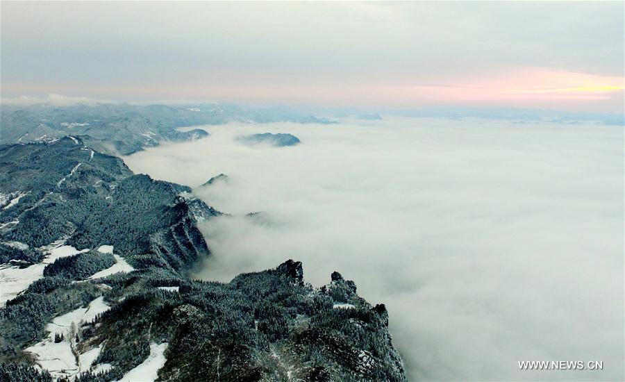 Aerial photo taken on Feb. 25, 2017 shows sea of clouds over the snow-covered mountains in Maoba Township, Lichuan City of central China's Hubei Province.