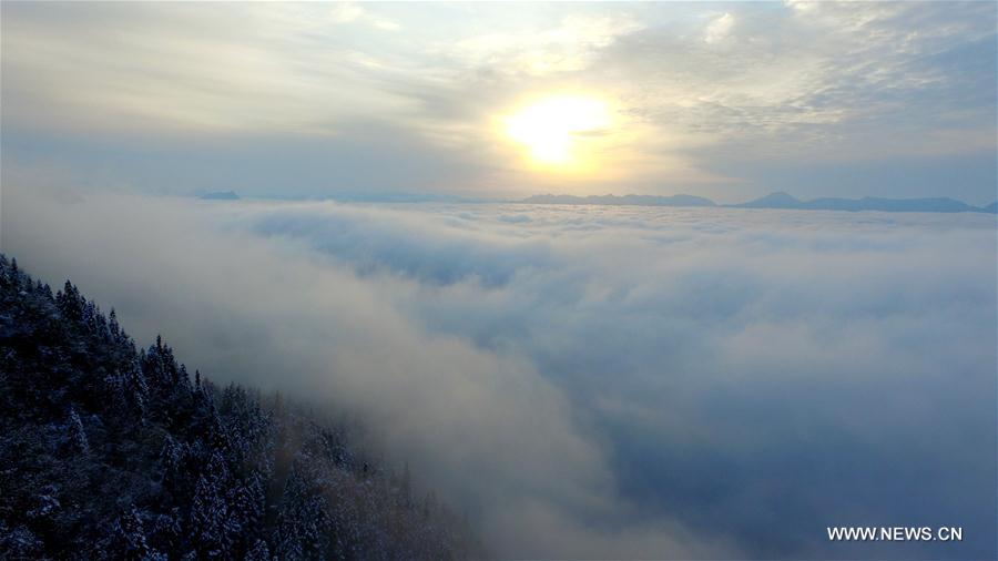 Aerial photo taken on Feb. 25, 2017 shows sea of clouds over the snow-covered mountains in Maoba Township, Lichuan City of central China's Hubei Province.