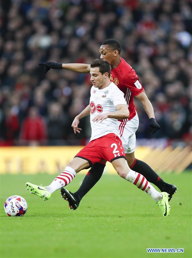 Manchester United's Anthony Martial (R) vies with Southampton's Cedric during the EFL Cup Final between Manchester United and Southampton at Wembley Stadium in London, Britain on Feb. 26, 2017. (Xinhua/Han Yan) 