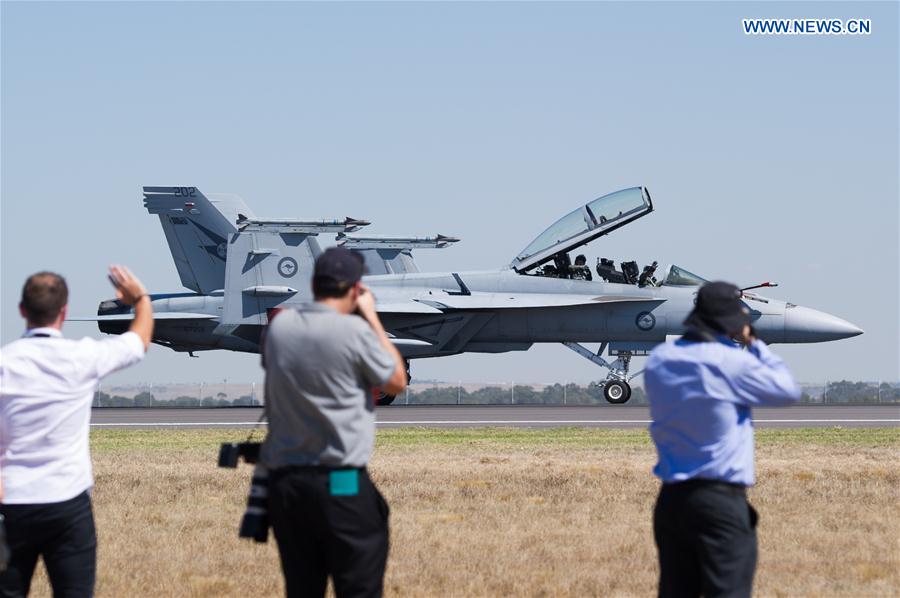 People take photos of a F-18F Super Hornet at the Australian International Aerospace and Defence Exposition at the Avalon Airfield, southwest of Melbourne, Australia, on Feb. 28, 2017. 