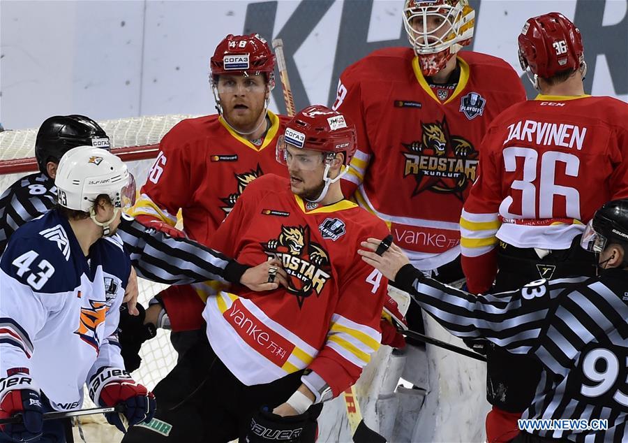 Players fight during a playoff game between Kunlun Red Star of China and Metallurg Magnitogorsk of Russia at the Kontinental Hockey League (KHL) in Beijing, capital of China, Feb. 28, 2017. Kunlun Red Star won 3-1.
