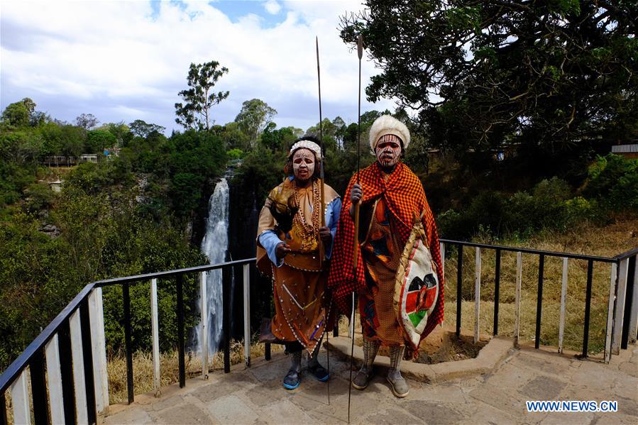 Kikuyu dancers pose for a photo near Thomson's falls in Nyahururu, 186 kilometers north of Kenya's capital Nairobi Feb. 28, 2017. The waterfall on a ledge of volcanic rock, discovered by Scottish geologist and naturalist Joseph Thomson in 1883, is a major economic resource for the adjacent town of Nyahururu. 