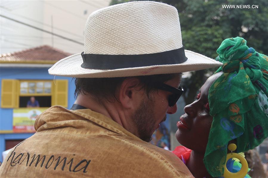 A couple participates in the street parade called 'Bastardo' during the Carnival in Sao Paulo, Brazil, Feb. 28, 2017. 