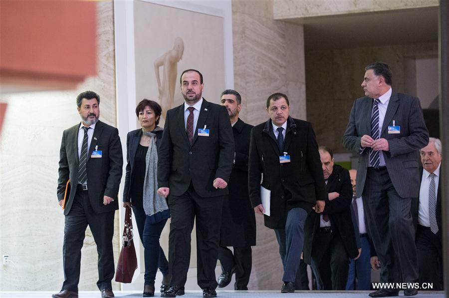 Syria's opposition delegation leader Nasr al-Hariri (front) attends a press conference at Palais des Nations in Geneva, Switzerland, March 3, 2017.